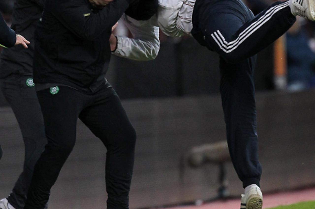 'Celtic\'s Neil Lennon is attacked by a fan during the Clydesdale Bank Scottish Premier League at Tynecastle Stadium, Edinburgh. Photo: Press Association/Pixsell'