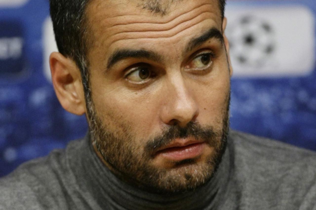 'Barcelona\'s coach Pep Guardiola attends a news conference at Camp Nou stadium in Barcelona, March 7, 2011. Barcelona and Arsenal will play their Champions League soccer match on March 8. REUTERS/Alb