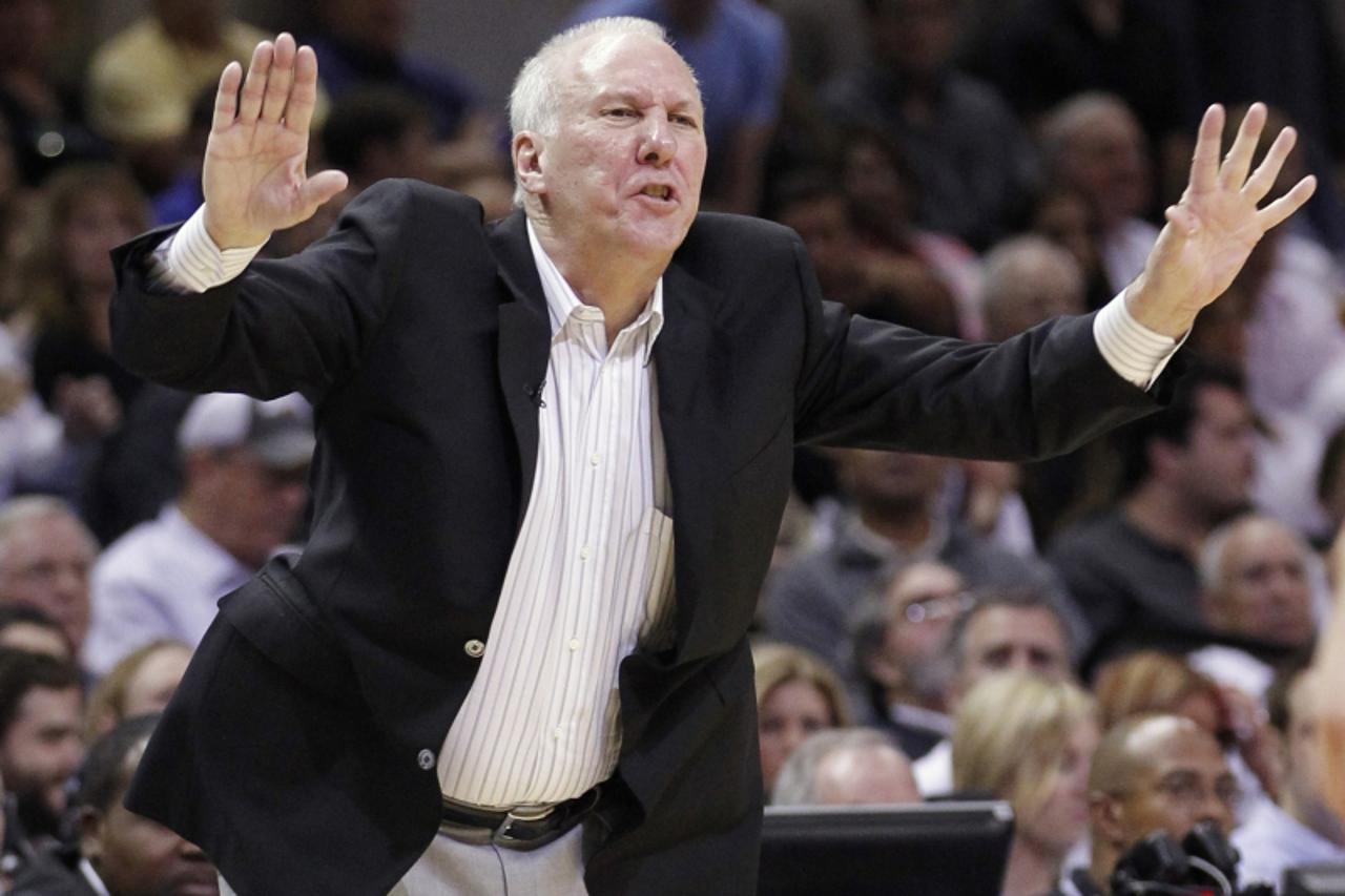 'San Antonio Spurs head coach Gregg Popovich signals towards the court during the second half of their NBA Western Conference semi-final playoff basketball game against the Los Angeles Clippers in San