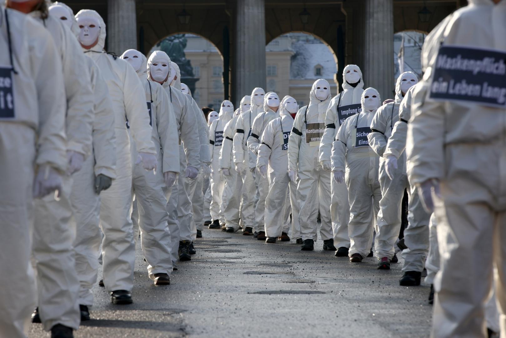 Demonstration against the COVID-19 measures and their economic consequences, in Vienna Protesters in white suits and wearing masks attend a demonstration against the coronavirus disease (COVID-19) measures and their economic consequences in Vienna, Austria, January 16, 2021. REUTERS/Lisi Niesner LISI NIESNER
