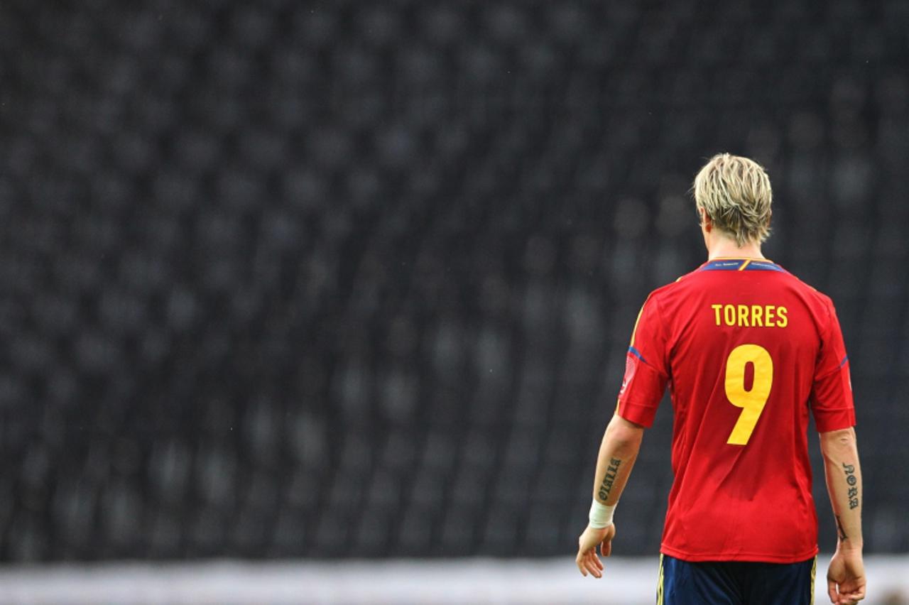 'Spain\'s national football team player Fernando Torres walks on the pitch during the international friendly football match between Spain and South Korea at the Stade de Suisse stadium, in Bern on May