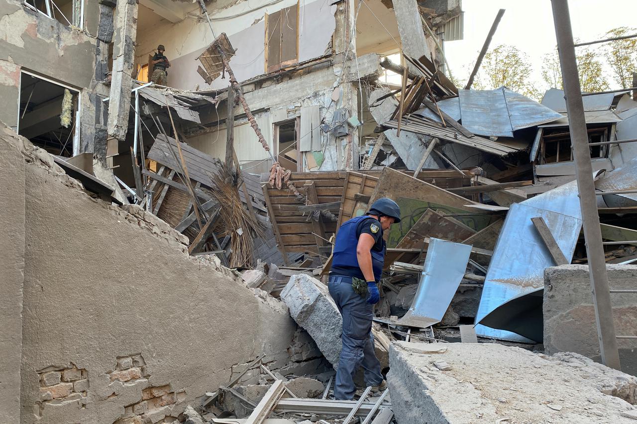Member of the State Emergency Service works at a site of a building of the Kharkiv National Technical University heavily damaged by a Russian missile strike in Kharkiv