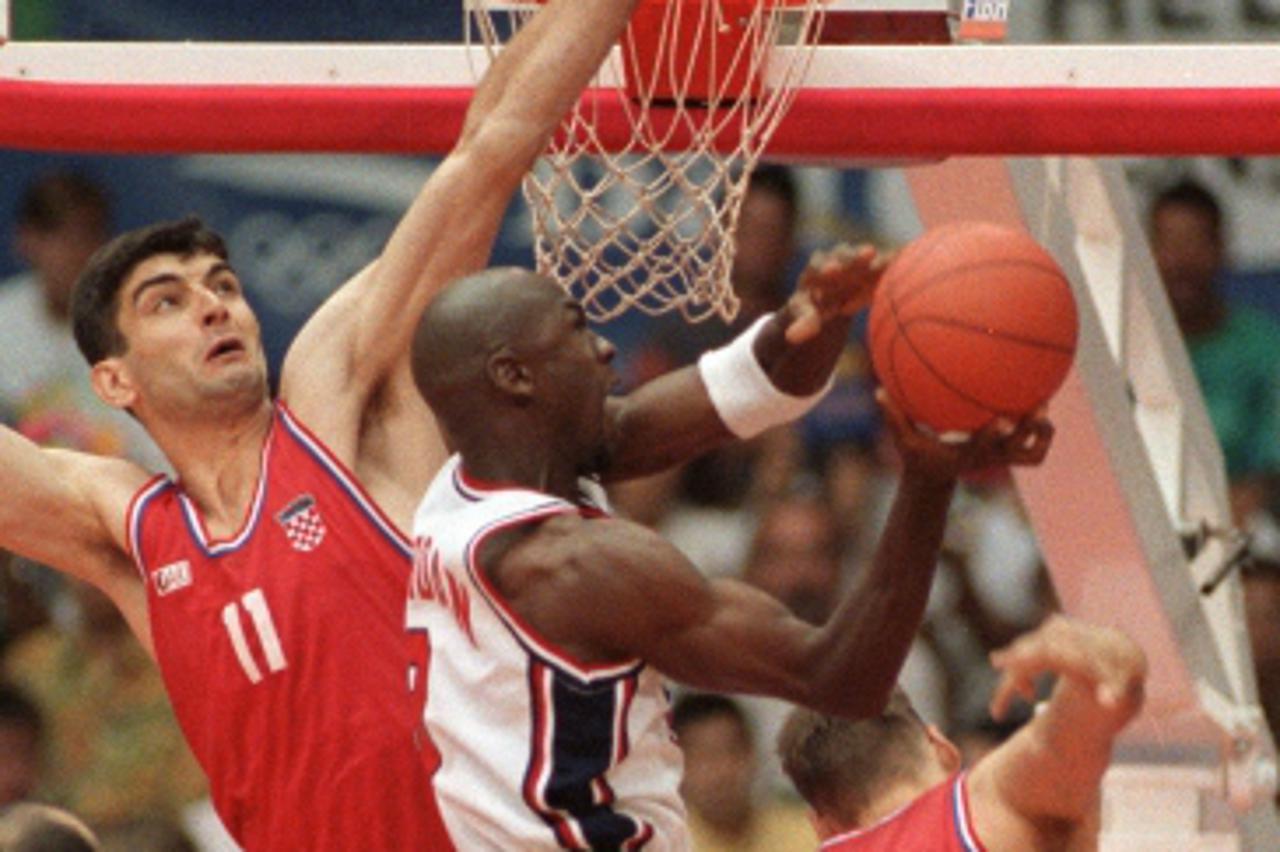 'American basketball star Michael Jordan smashes during the final of the 1992 Barcelona Olympic basketball tournament opposing the USA to Croatia 08 August 1992. '
