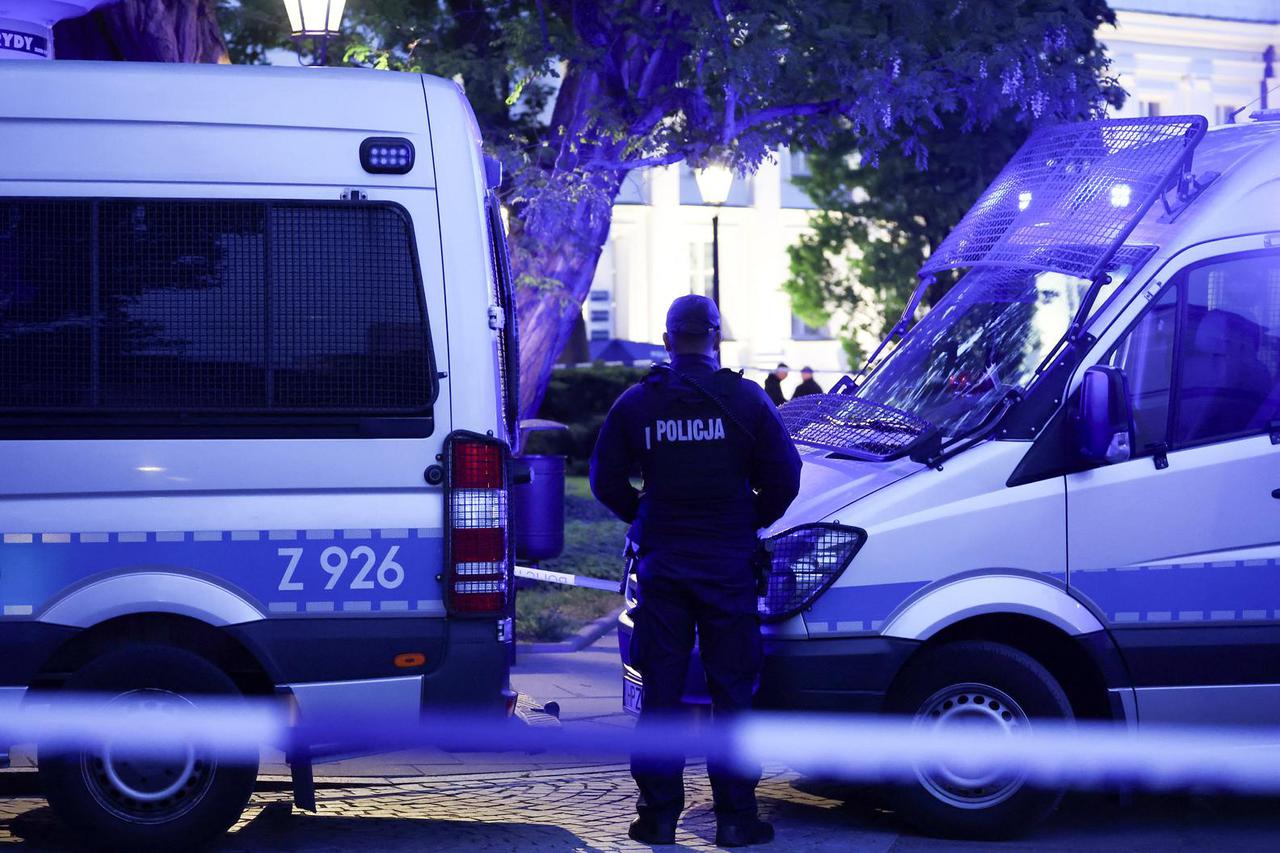 Polish police secure an earea at the Warsaw University after an attack with an axe