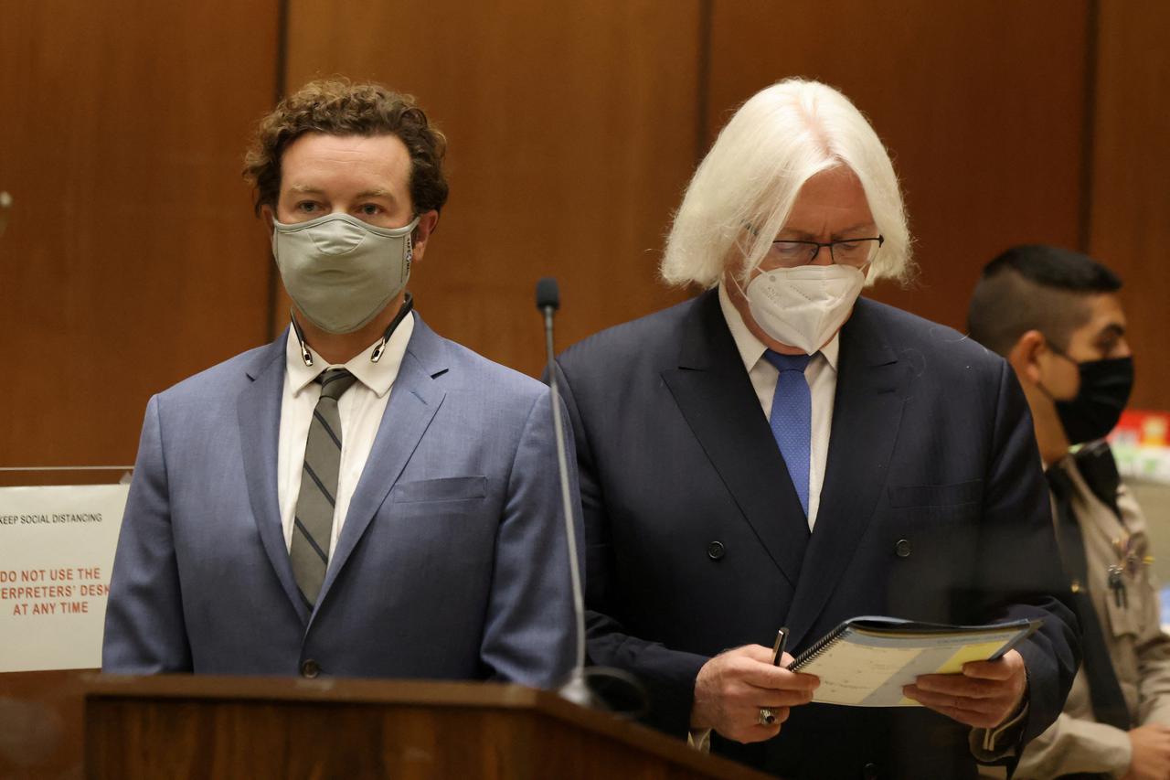 FILE PHOTO: Actor Danny Masterson stands with his lawyer Thomas Mesereau as he is arraigned on three rape charges in separate incidents between 2001 and 2003, at Los Angeles Superior Court, Los Angeles