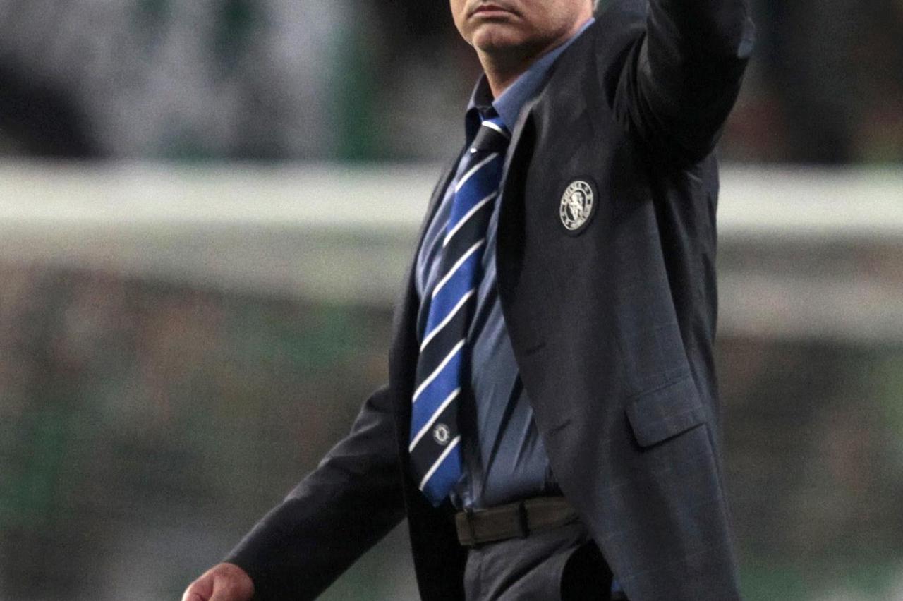 Chelsea's coach Jose Mourinho gestures after their Champions League Group G soccer match against Sporting Lisbon at the Estadio Jose Alvade in Lisbon, September 30, 2014.        REUTERS/Hugo Correia (PORTUGAL  - Tags: SPORT SOCCER)