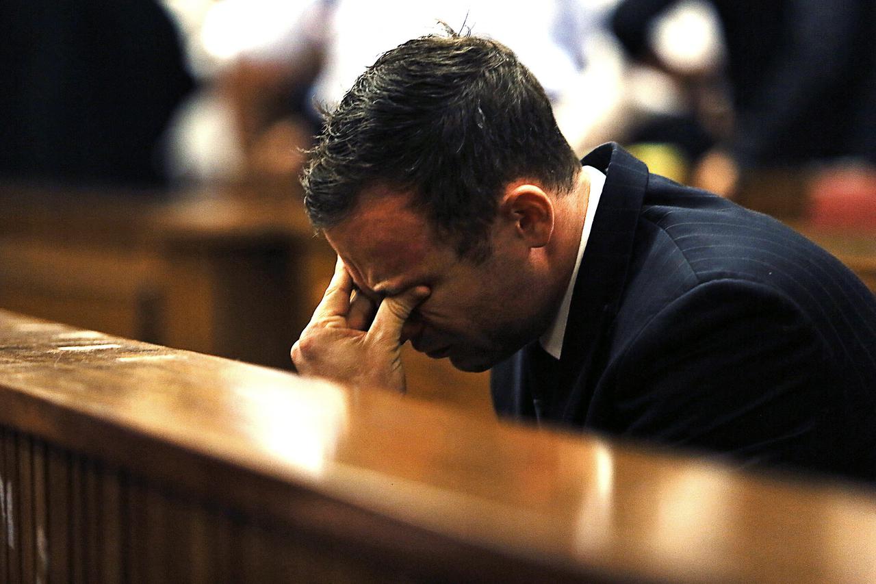 FILE PHOTO: Olympic and Paralympic track star Pistorius reacts as Judge Masipa delivers her verdict at the North Gauteng High Court in Pretoria
