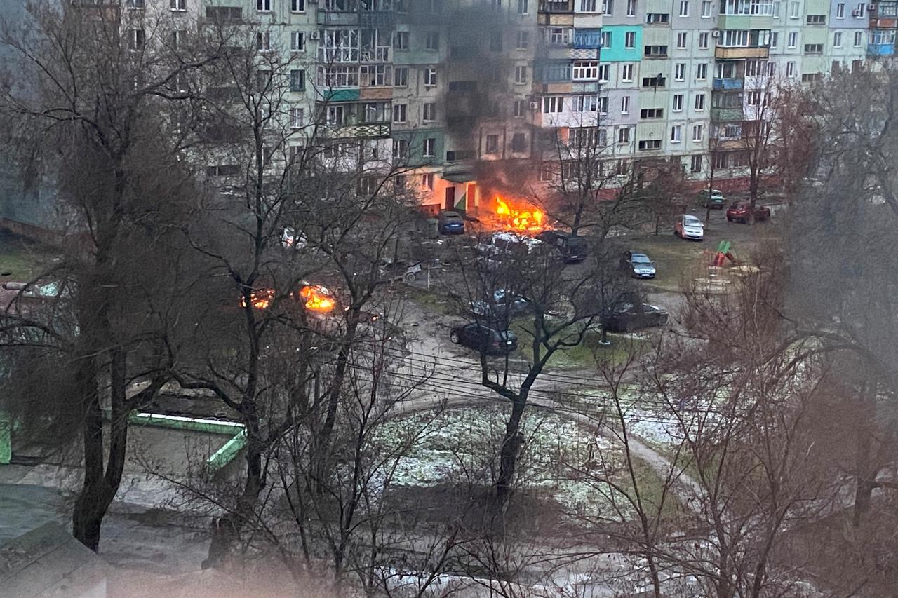 Ukrainian serviceman stands near captured Russian tanks in the north of the Kharkiv region