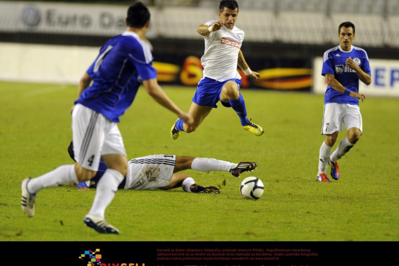 '25.09.2011., Poljud, Split - 1. HNL, 9. kolo, Hajduk Split - Slaven Belupo.  Anas Sharbini protiv Elvisa Kokalovica, Josipa Milardovica i Gorana Mujanovica.  Photo: Tino Juric/PIXSELL'