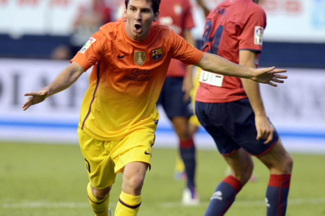 'Barcelona\'s Lionel Messi celebrates a goal against Osasuna during their Spanish first division soccer match at Reyno de Navarra stadium in Pamplona August 26, 2012. REUTERS/Vincent West (SPAIN - Tag
