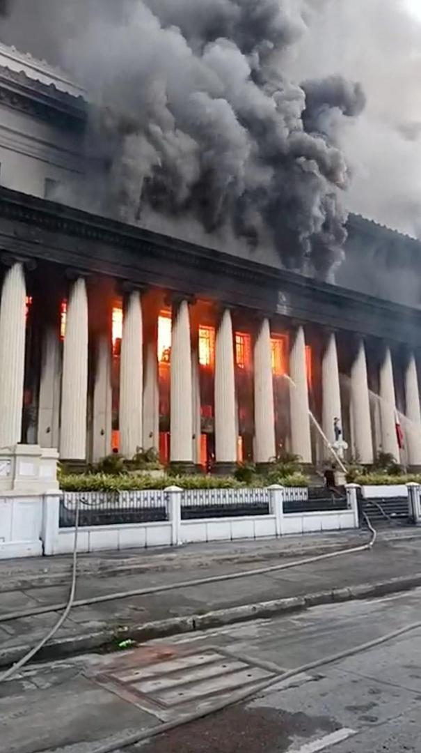 Firefighters spray water to control the massive fire at the Manila Central Post Office building in Manila, Philippines, May 22, 2023.  Ermita Malate Fire and Rescue Volunteer/Handout via REUTERS    THIS IMAGE HAS BEEN SUPPLIED BY A THIRD PARTY. MANDATORY CREDIT. NO RESALES. NO ARCHIVES. Photo: ERMITA MALATE FIRE AND RESCUE VO/REUTERS