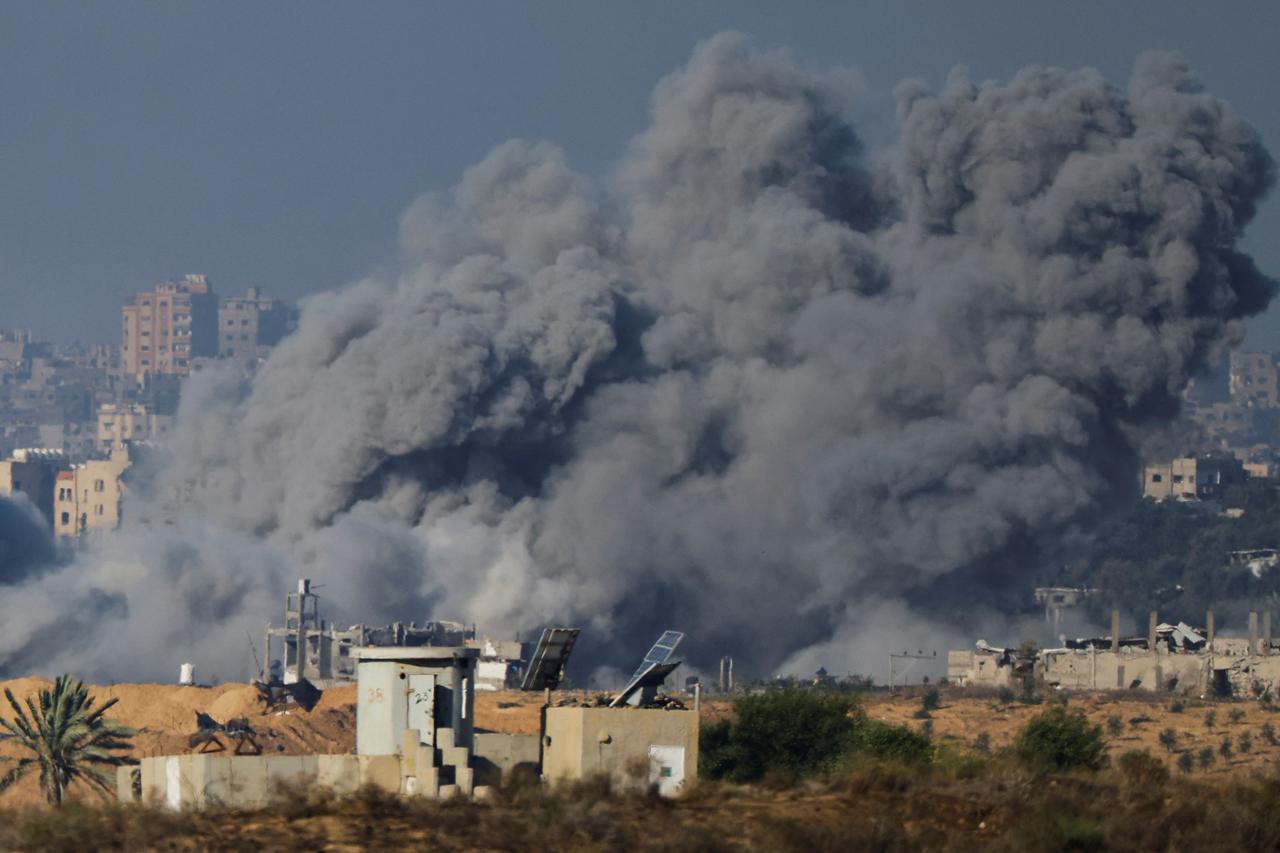 Smoke rises after Israeli air strikes in Gaza, as seen from southern Israel