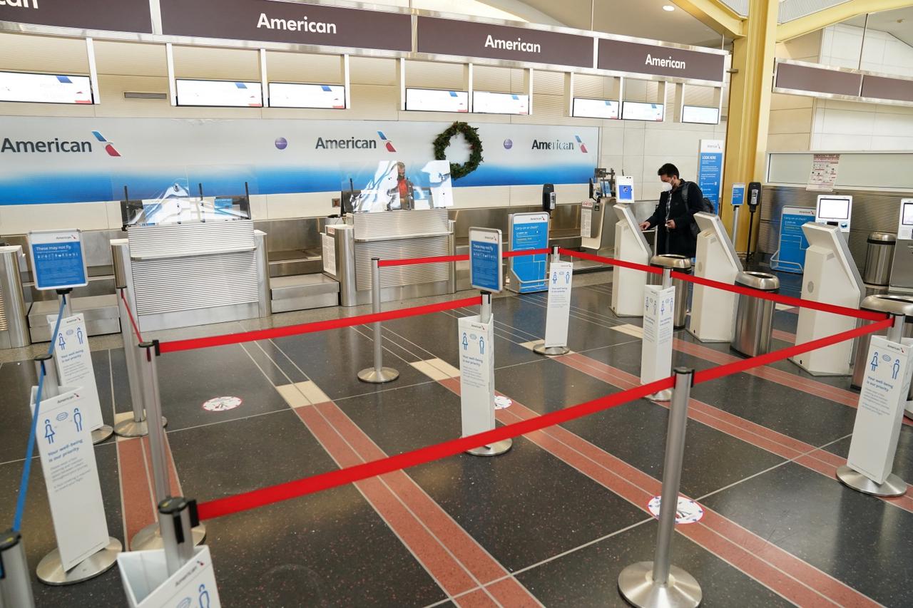 A holiday-week traveler checks in for his flight from Ronald Reagan Washington National Airport in Arlington, Virginia