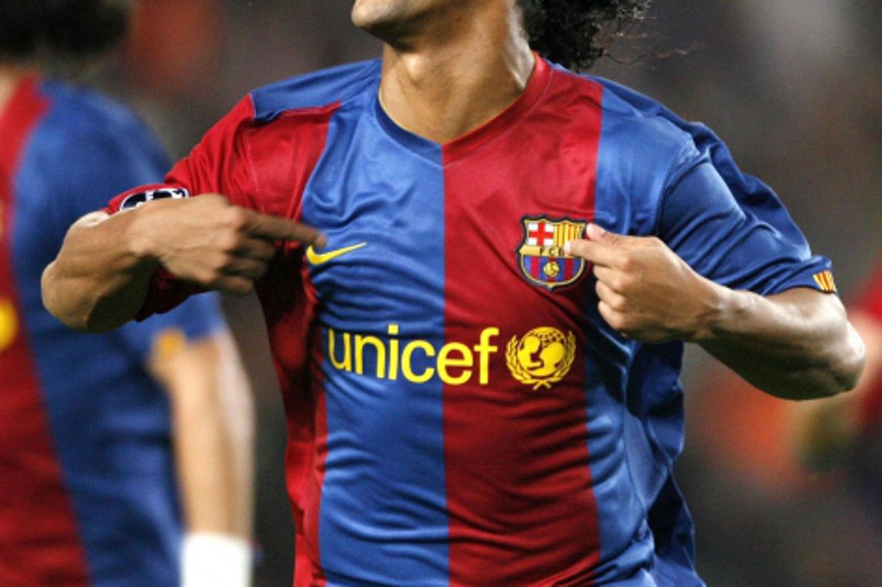 'Barcelona\'s Ronaldinho celebrates a goal against Werder Bremen during their Champions League Group A soccer match at Nou Camp Stadium in Barcelona December 5, 2006. REUTERS/Albert Gea (SPAIN))'