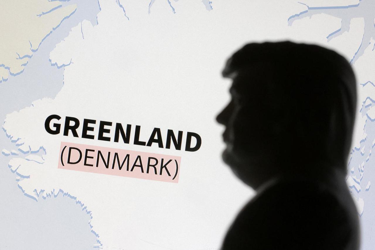 Illustration shows 3D-printed miniature model of Donald Trump and Greenland map