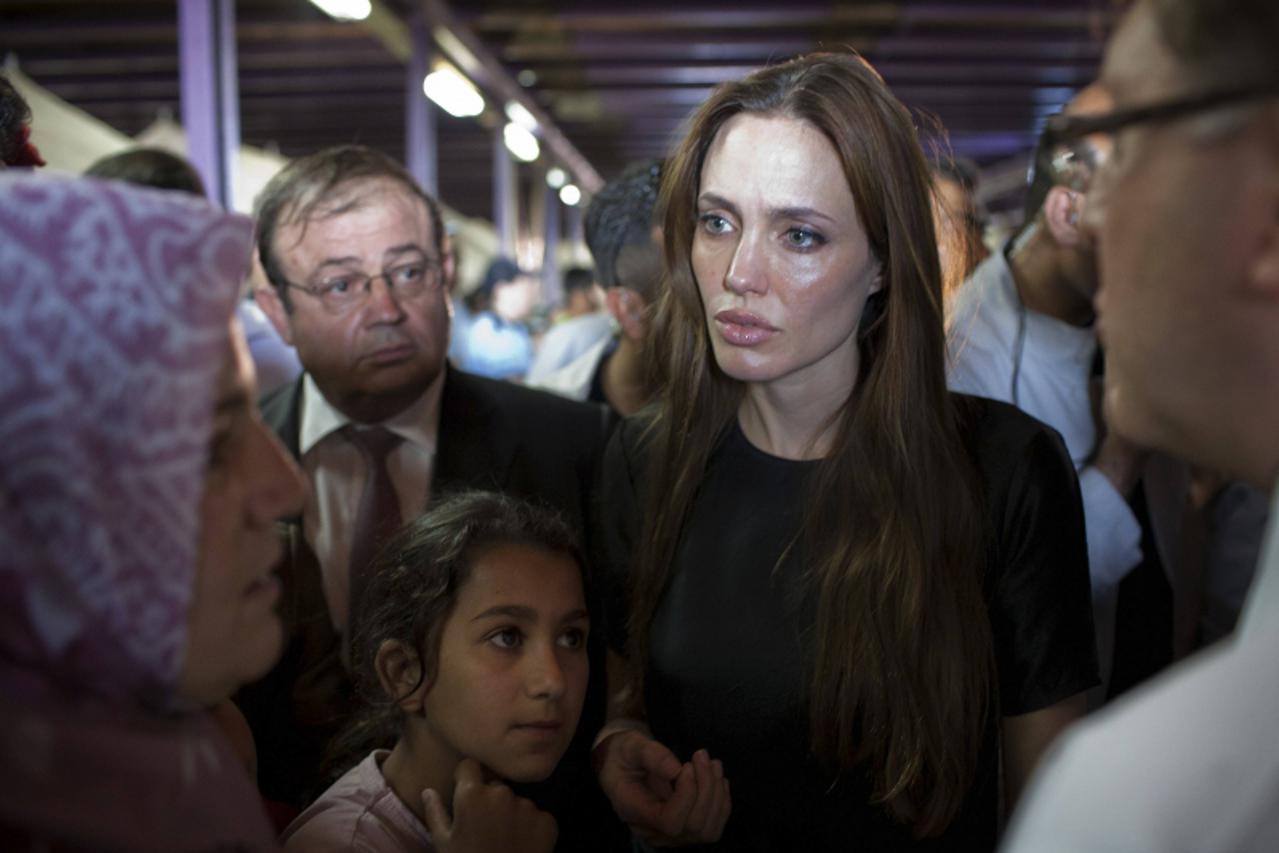 'United Nations High Commissioner for Refugees (UNHCR) Goodwill Ambassador Angelina Jolie meets with Syrian refugees at the Altinozu refugee camp in Hatay province, 20km (12.4 miles) from the Syrian b