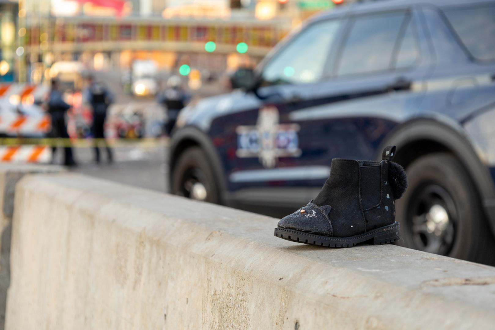 (240215) -- KANSAS CITY, Feb. 15, 2024 (Xinhua) -- A shoe is seen at the site following a shooting in Kansas City, Missouri, the United States, Feb. 14, 2024. At least one person was killed and 22 were injured as gunfire erupted during the Kansas City Chiefs' Super Bowl victory parade in Kansas City, U.S. state of Missouri, Stacey Graves, chief of the Kansas City Missouri Police Department, said at a news conference on Wednesday afternoon. (Photo by Robert Reed/Xinhua) Photo: Robert Reed/XINHUA