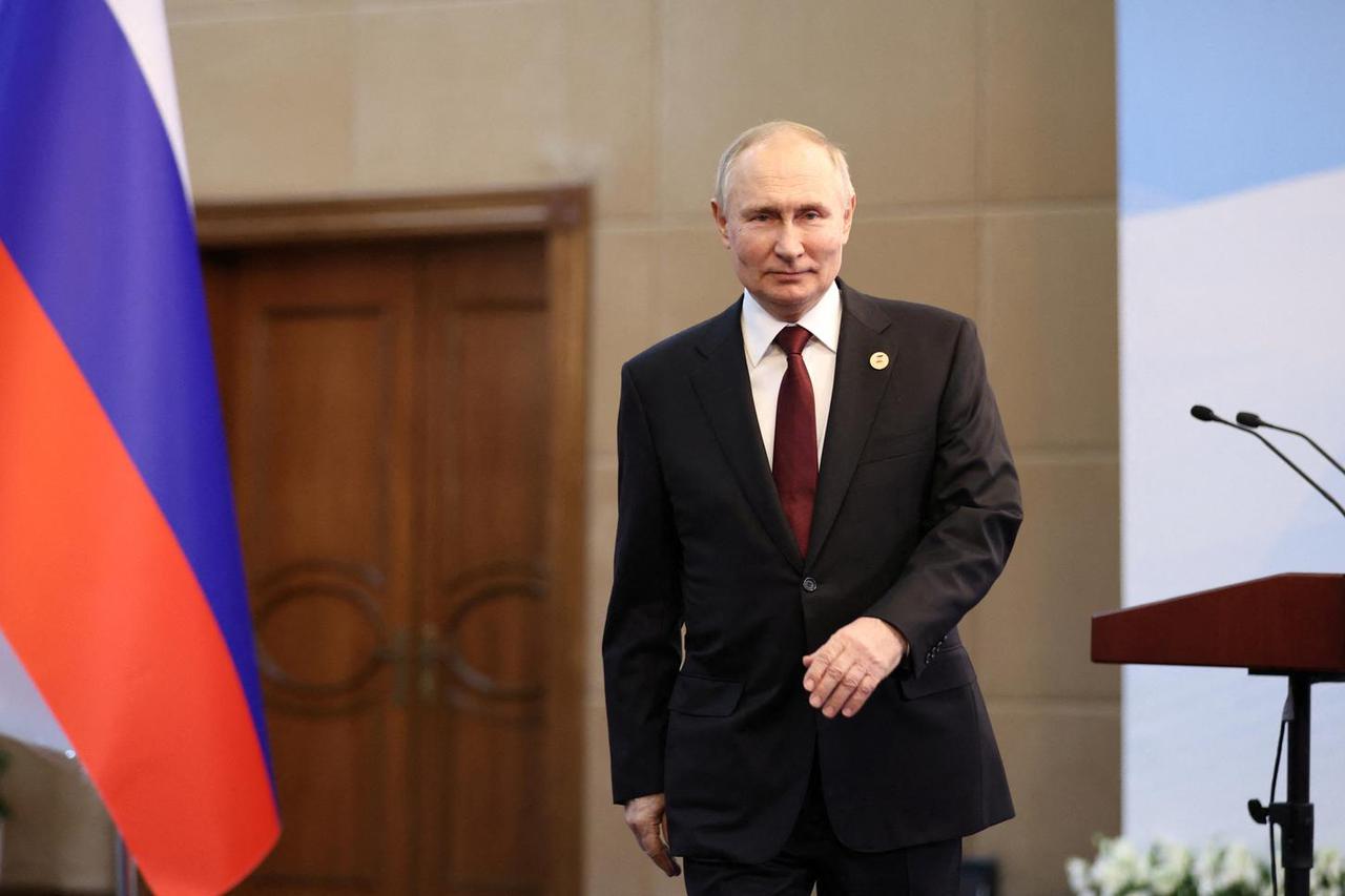Russian President Putin attends a news conference in Bishkek