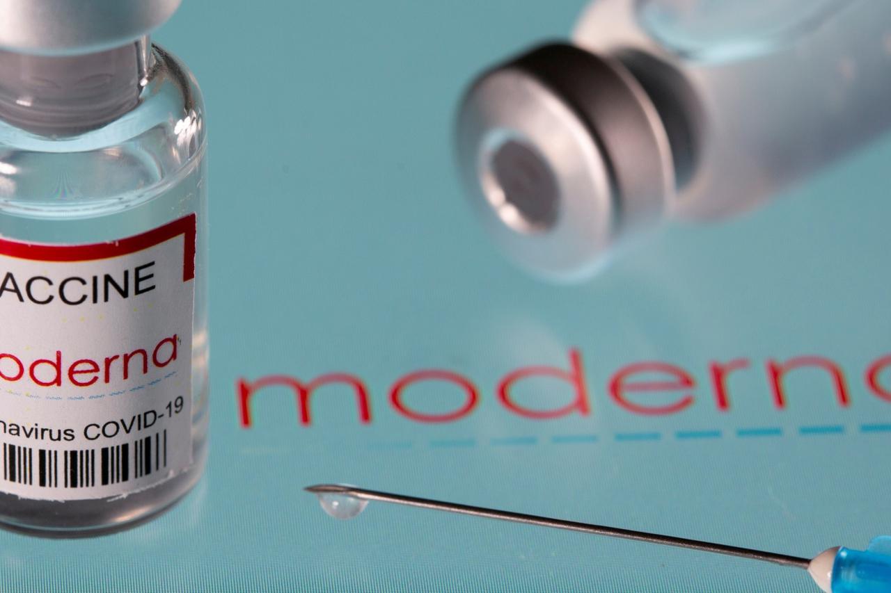 FILE PHOTO: Vial labelled "Moderna coronavirus disease (COVID-19) vaccine" placed on displayed Moderna logo is seen in this illustration picture