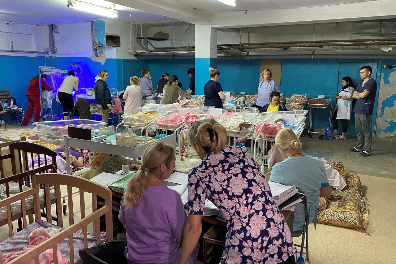 Women with their newborn babies take shelter in the basement of a perinatal centre in Kharkiv