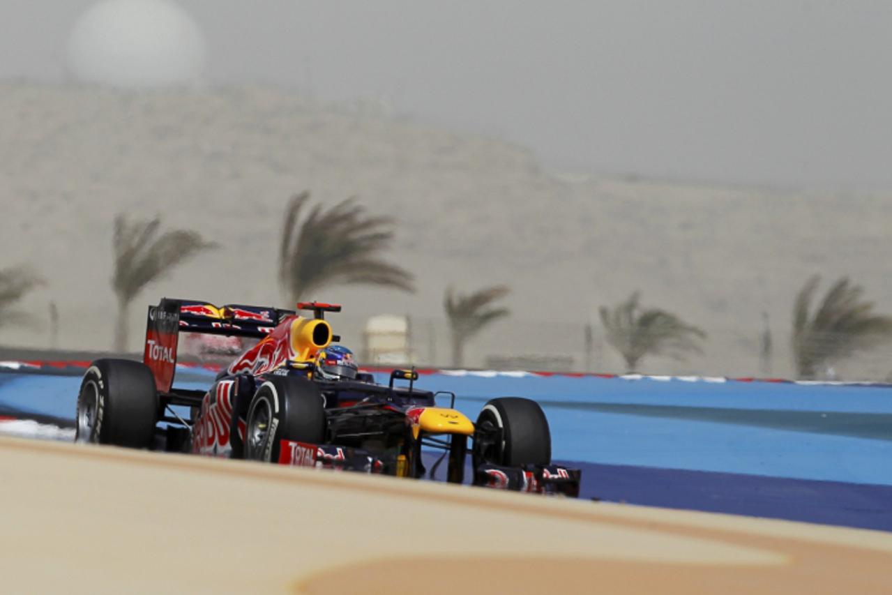 'Red Bull Formula One driver Sebastian Vettel of Germany drives during the qualifying session of the Bahrain F1 Grand Prix at the Sakhir circuit in Manama April 21, 2012. Vettel took his first pole po