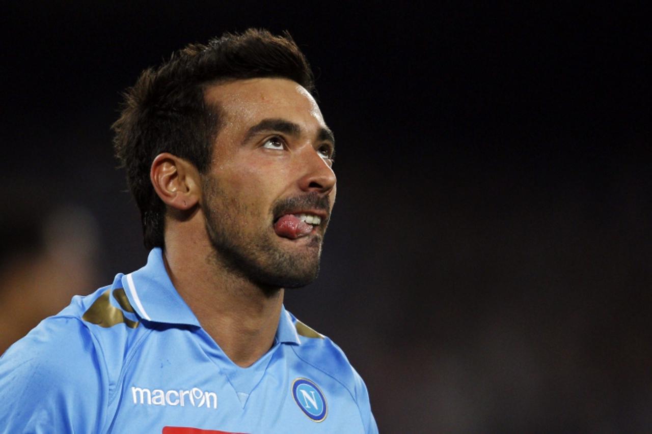'Napoli\'s Ezequiel Lavezzi reacts after missing a scoring opportunity against Manchester City during their Champions League Group A soccer match at the San Paolo stadium in Naples November 22, 2011. 