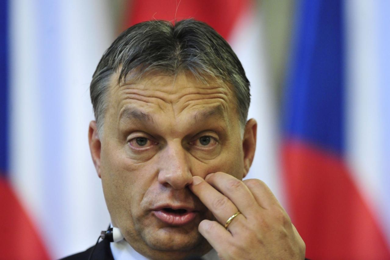 'Hungarian Prime Minister Viktor Orban gives a press conference at the Hungarian Parliament in Budapest on December 15, 2011 with his Czech counterpart. Czech Prime Minister Petr Necas is on a one-day