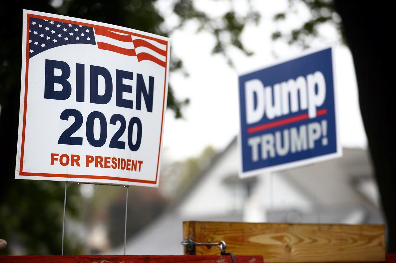 Yard signs supporting Democratic U.S. presidential nominee and former Vice President Joe Biden and against U.S President Donald Trump are seen outside of a house in Lancaster