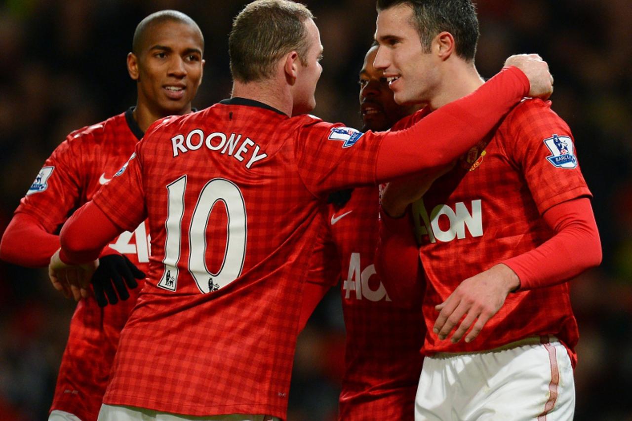 'Manchester United\'s English forward Wayne Rooney (2-L) celebrates after scoring the third goal with Manchester United\'s Dutch forward Robin van Persie (R) during the English Premier League football