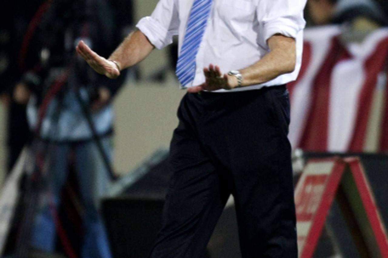 'Israel\'s coach French Luis Fernandez reacts at the Bloomfield Staduim in Tel Aviv on March 26, 2011 during their Euro 2012 qualifying group F football match againts Latvia. Israel won 2-1. AFP PHOTO