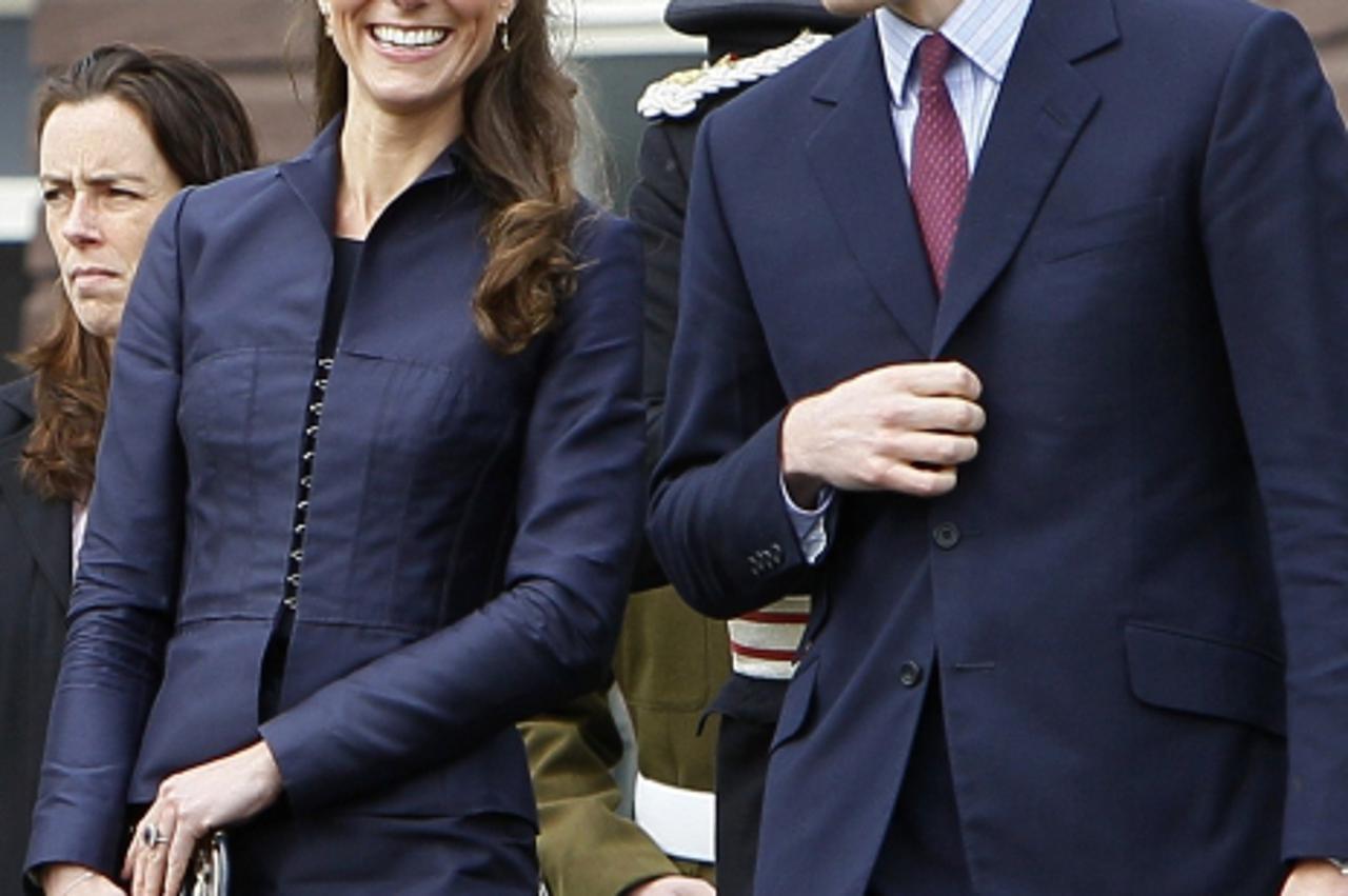 'Britain\'s Prince William (R) and his fiancee Kate Middleton are pictured during a visit to Witton County Park, in Darwen, north-west England, on April 11, 2011. The couple also visited Darwen Aldrid