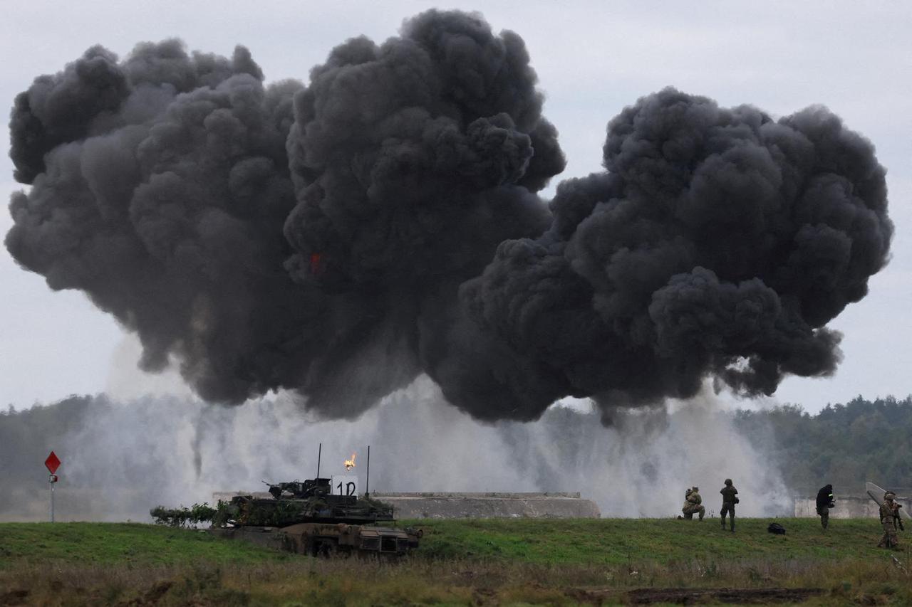 FILE PHOTO: Polish forces with NATO soldiers hold military exercises 'Iron Defender' at Orzysz training ground in Wierzbiny