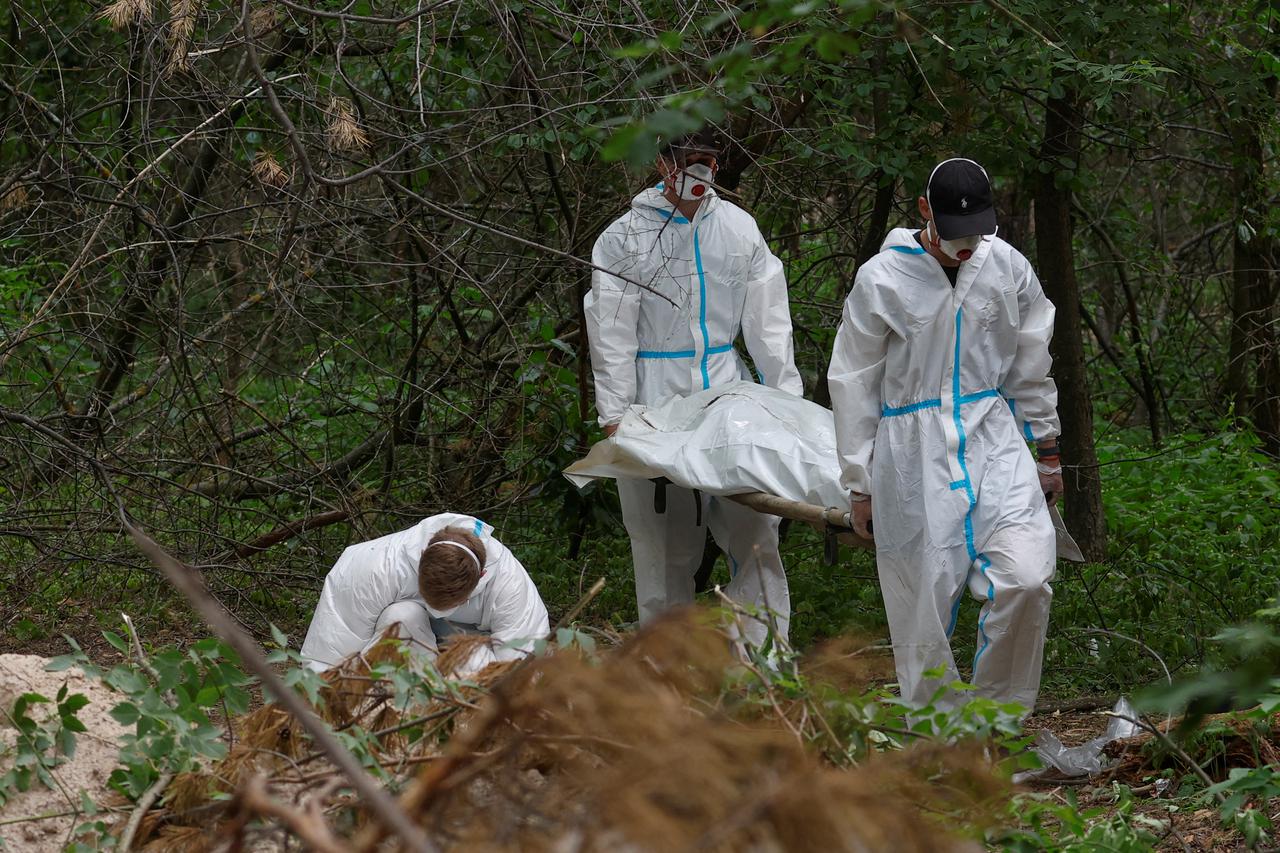 Exhumation of bodies of people from a mass grave in Bucha district