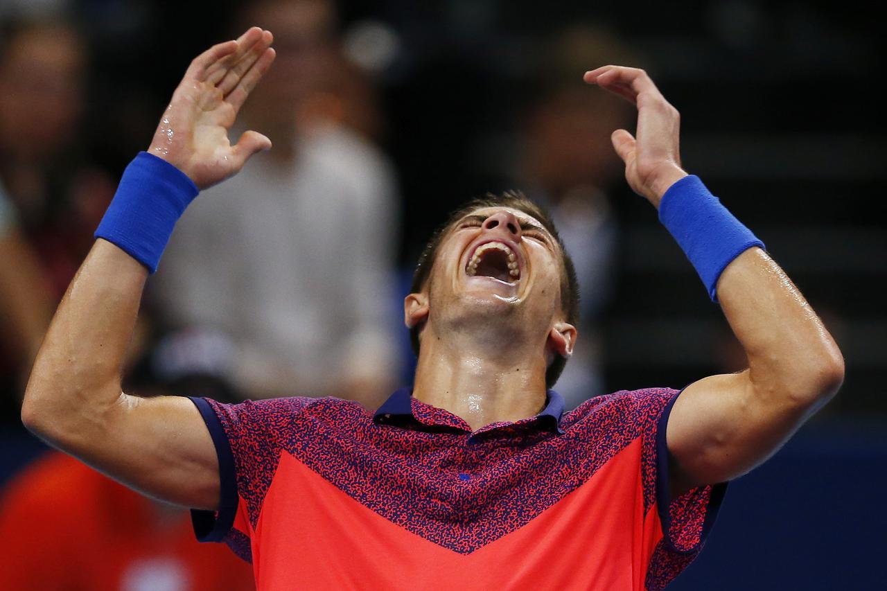 REFILE - CLARIFYING NATIONALITY OF NADAL  Borna Coric of Croatia reacts after winning his match against Spain's Rafael Nadal at the Swiss Indoors ATP tennis tournament in Basel October 24, 2014.   REUTERS/Arnd Wiegmann (SWITZERLAND - Tags: SPORT TENNIS TP