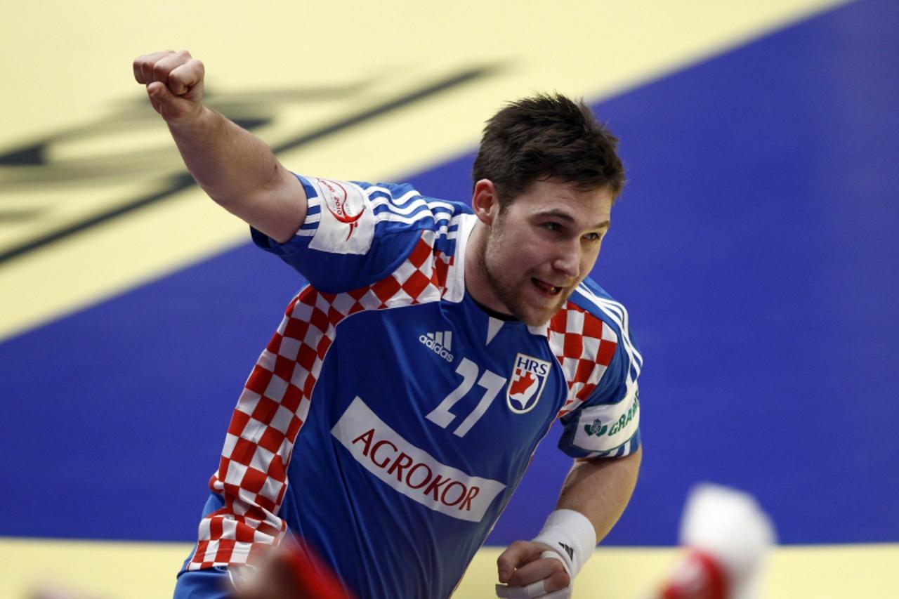 'Croatia\'s Ivan Cupic celebrates a goal during their Men\'s European Handball Championship semi-final match against Poland in Vienna January 30, 2010.  REUTERS/Nikola Solic (AUSTRIA - Tags: SPORT HAN