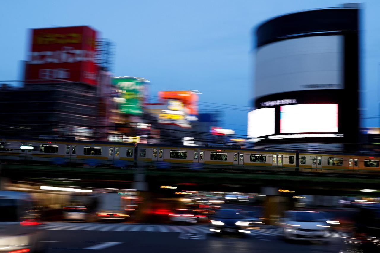A train approaches Shinjuku Station in Tokyo