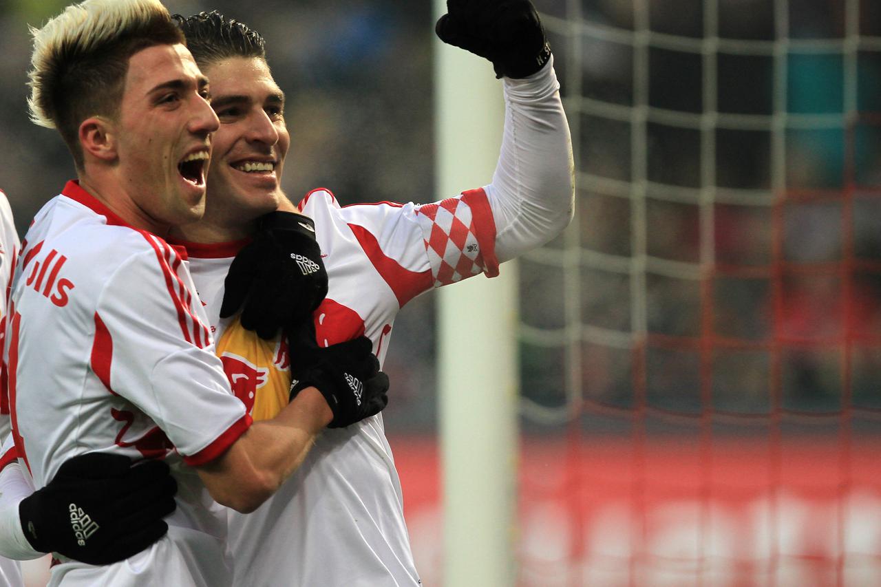 Salzburg's Jonatan Soriano (R) and Kevin Kampl cheer after their goal for 2-0 during the tryout between Red Bull Salzburg and FC Bayern Munich in the Red Bull Arena in Salzburg, Austria, 18 January 2014. Photo: Max Nikelski/dpa -NO WIRE SERVICE-/DPA/PIXSE