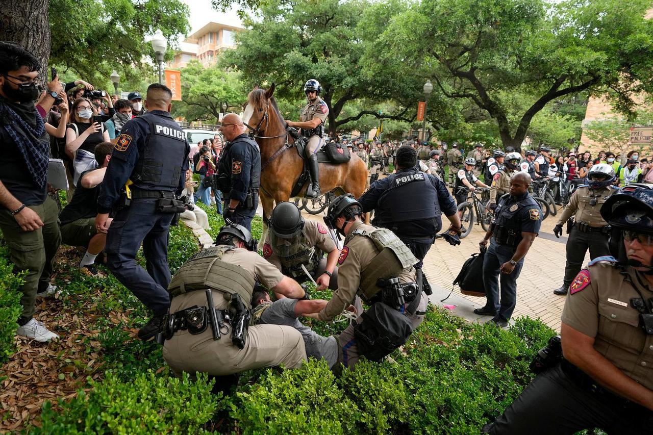 Law enforcement carry a pro-Palestinian protester at the University of Texas