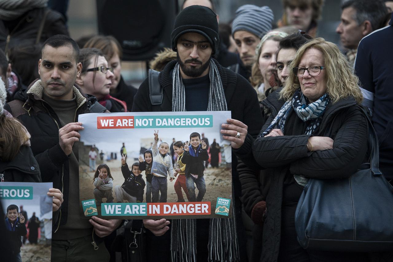 Migrants supporters hold the protest in front of European Commission and European Council headquarters in Brussels, Belgium on 16.03.2016 People take part in an Blackdays solidarity wake along with migrants one day before an EU Summit with Turkey. The pro