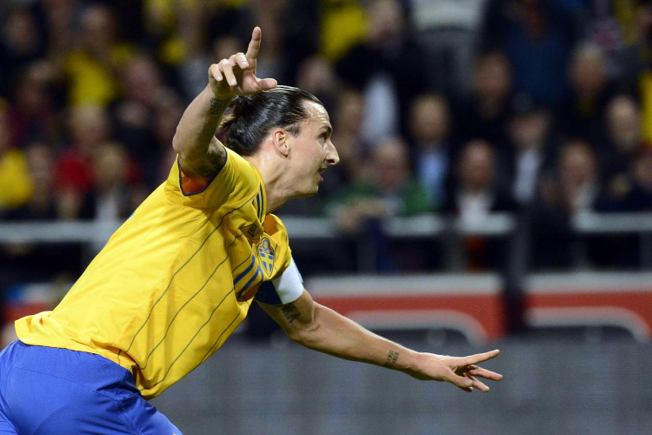 'Sweden's striker and team captain Zlatan Ibrahimovic celebrates after scoring his 1st goal of the match during the FIFA World Cup 2014 friendly match England vs Sweden in Stockholm, Sweden on Novemb