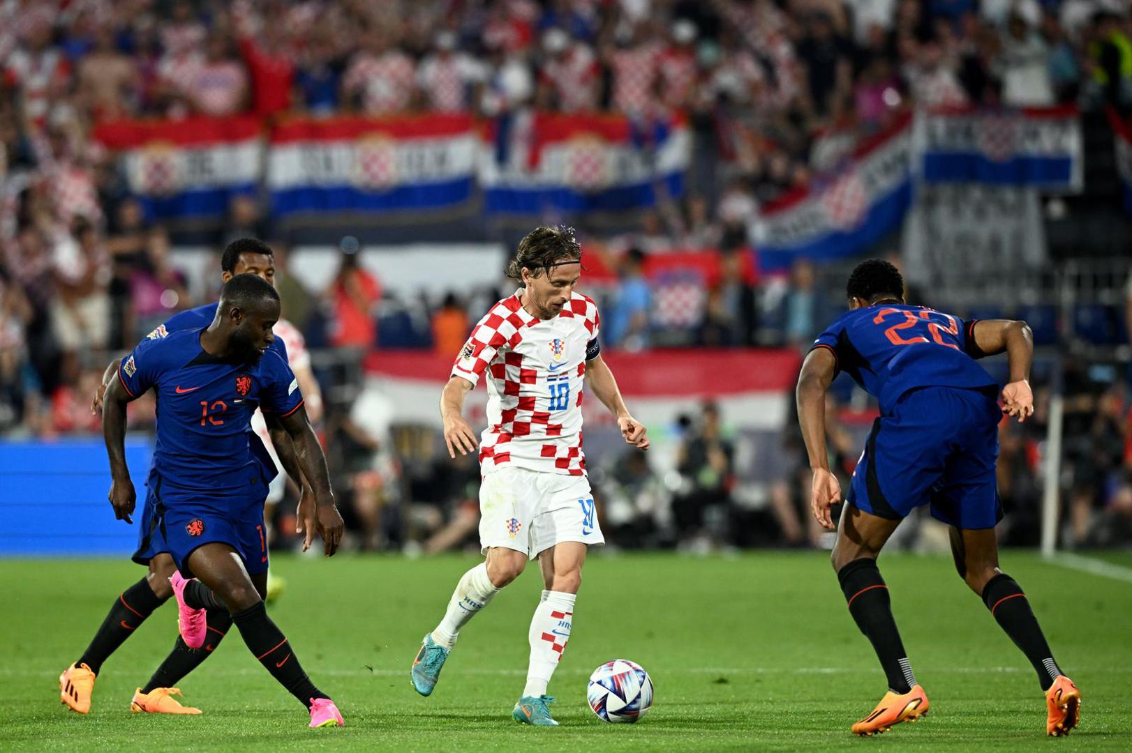 14.06.2023., stadion Feyenoord "De Kuip", Rotterdam, Nizozemska - UEFA Liga Nacija, polufinale, Nizozemska - Hrvatska. Lutsharel Geertruida, Luka Modric Photo: Marko Lukunic/PIXSELL