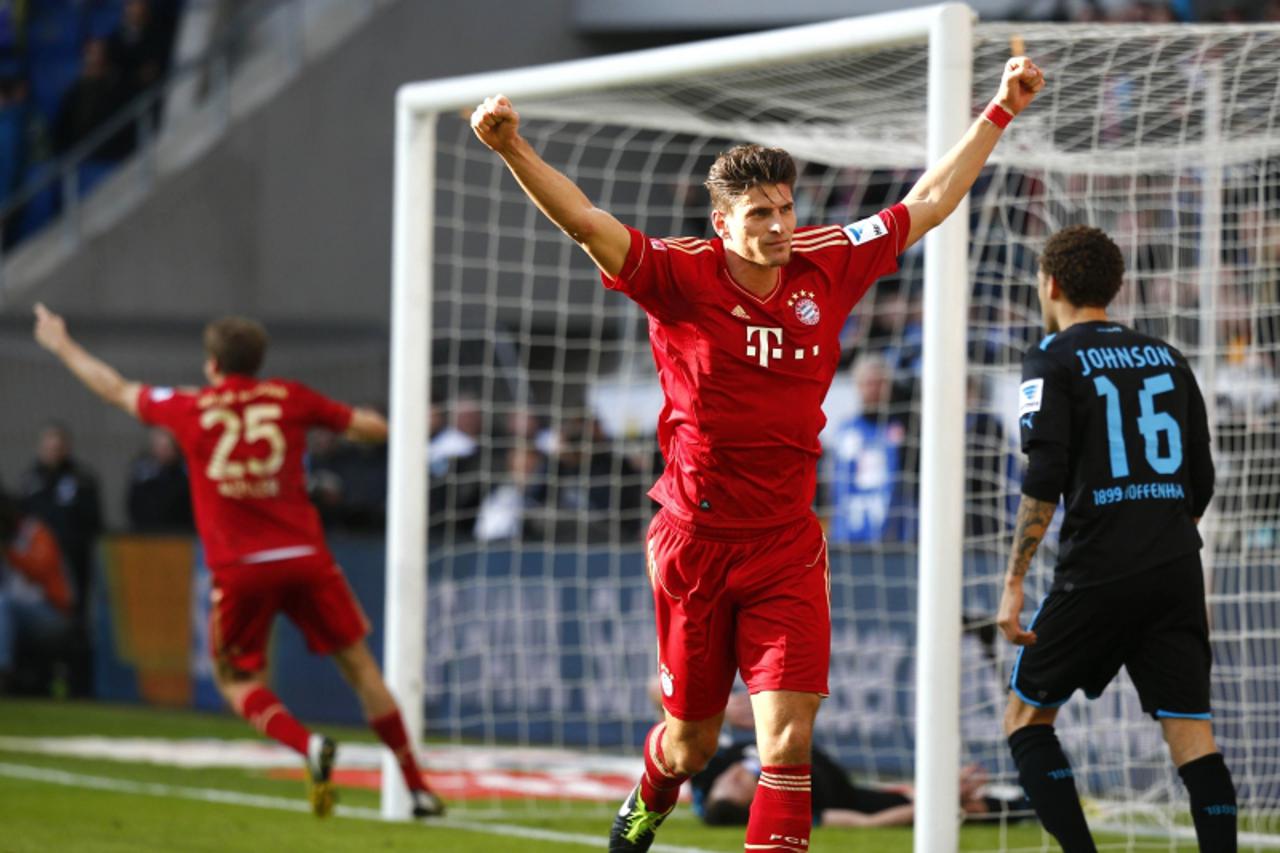 'Mario Gomez of Bayern Munich celebrates a goal against TSG Hoffenheim during their German first division Bundesliga soccer match in Sinsheim, March 3, 2013.  REUTERS/Kai Pfaffenbach (GERMANY - Tags: 