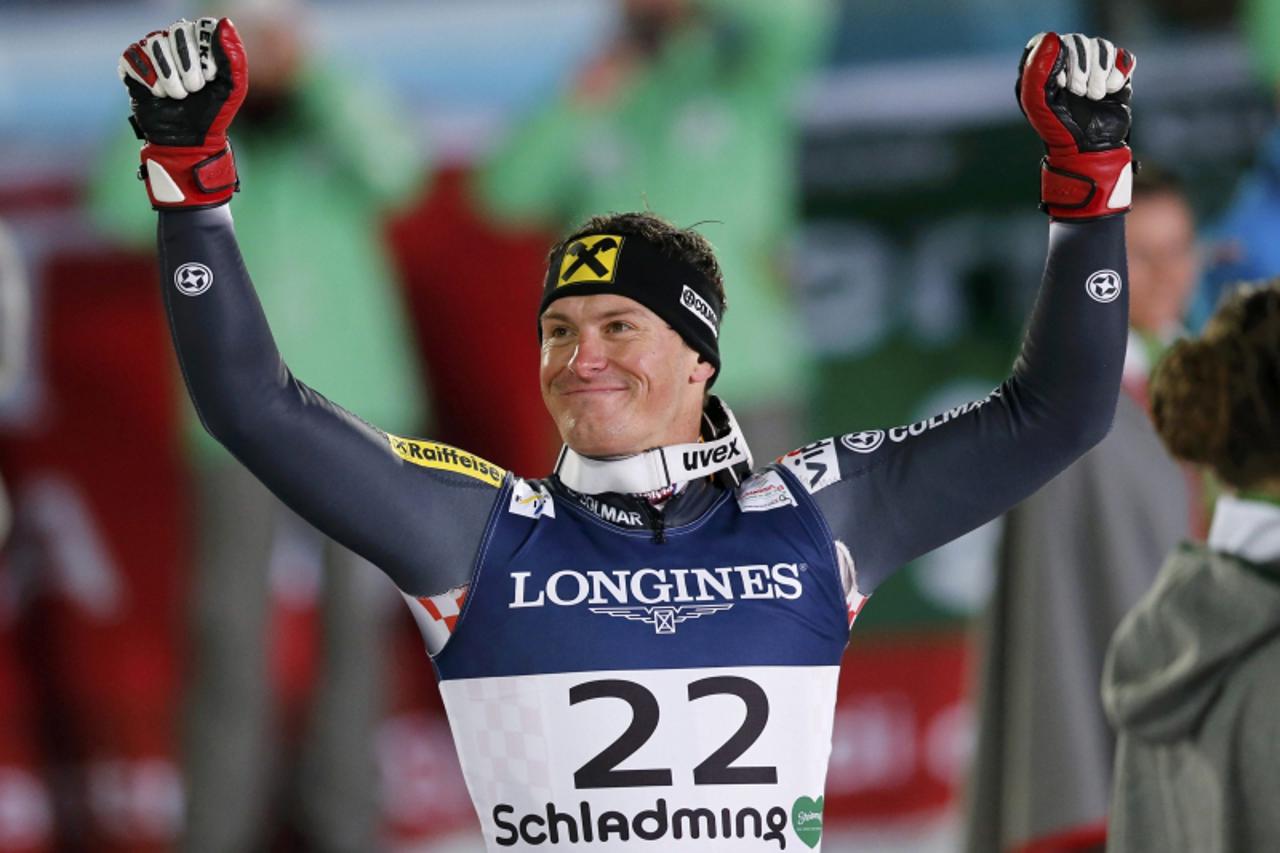'Second placed Ivica Kostelic of Croatia celebrates after the men\'s super combined event at the World Alpine Skiing Championships in Schladming February 11, 2013. REUTERS/Leonhard Foeger (AUSTRIA  - 