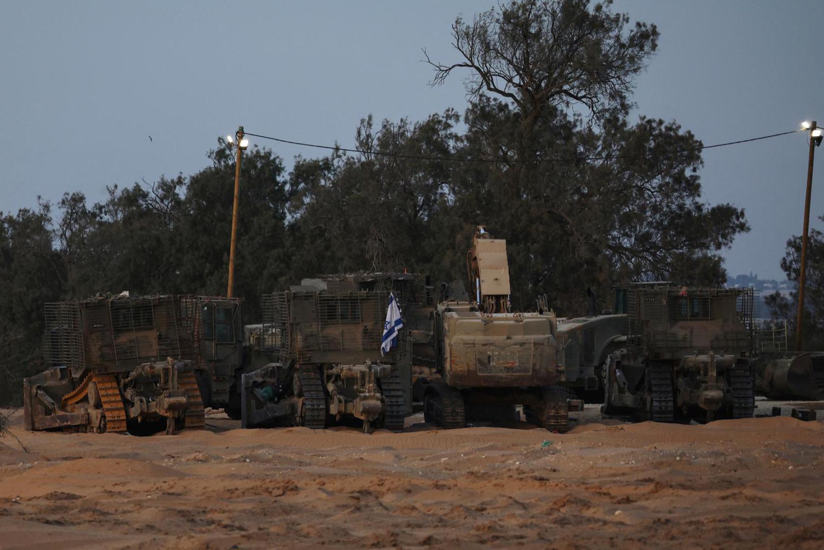 Israeli military armored vehicles sit in a staging area near the Kerem Shalom border crossing, as military operations continue in the southern Gaza city of Rafah, in Kerem Shalom, Israel, May 17, 2024. REUTERS/Shannon Stapleton Photo: SHANNON STAPLETON/REUTERS