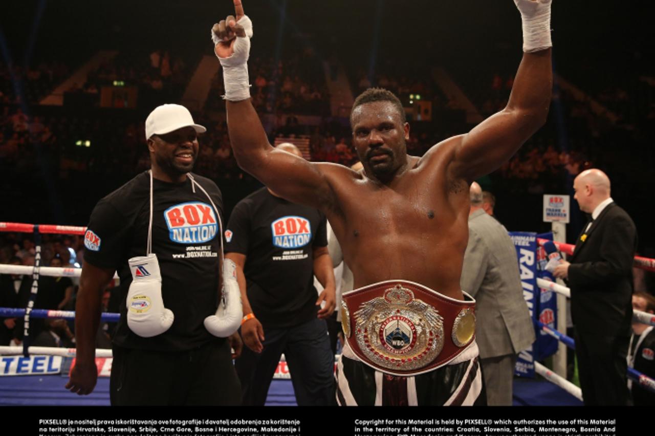 'Dereck Chisora celebrates defeating Malik Scott in their Vacant WBO International Heavyweight Title fight at Wembley Arena, London.Photo: Press Association/PIXSELL'