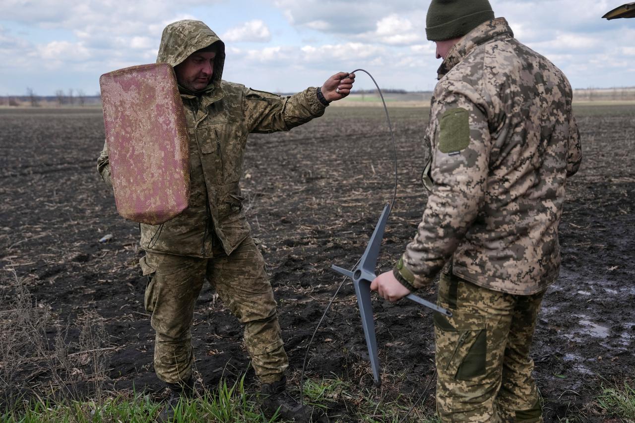 FILE PHOTO: Ukrainian servicemen set up Starlink satellite internet system near the frontline town of Pokrovsk