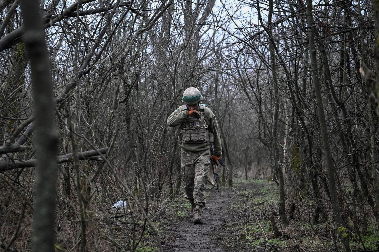 Ukrainian servicemen fire a howitzer towards Russian troops near the frontline town of Pokrovsk