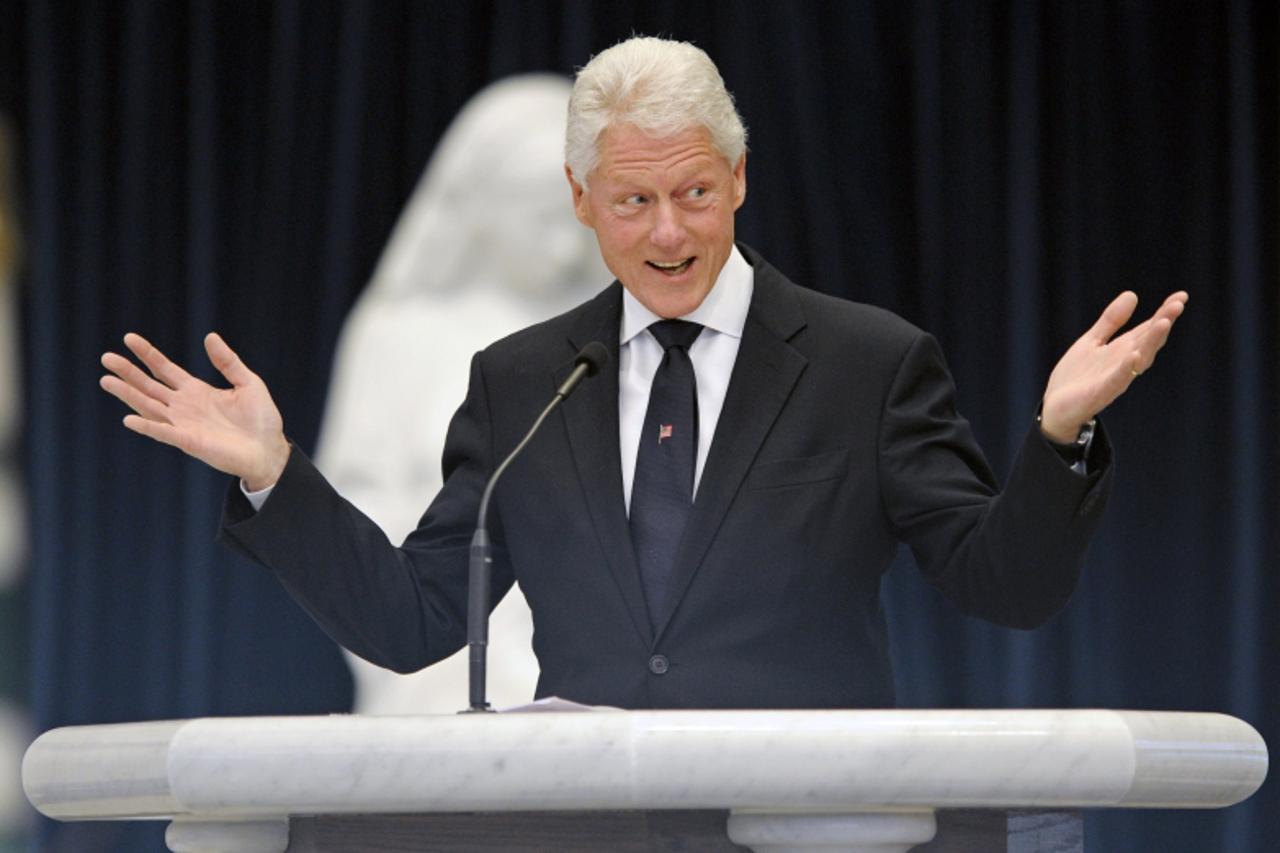 'Former U.S. President Bill Clinton speaks during the funeral mass for Sargent Shriver at Our Lady of Mercy Parish in Potomac, Maryland, January 22, 2011. Shriver, an in-law of the Kennedy family, die