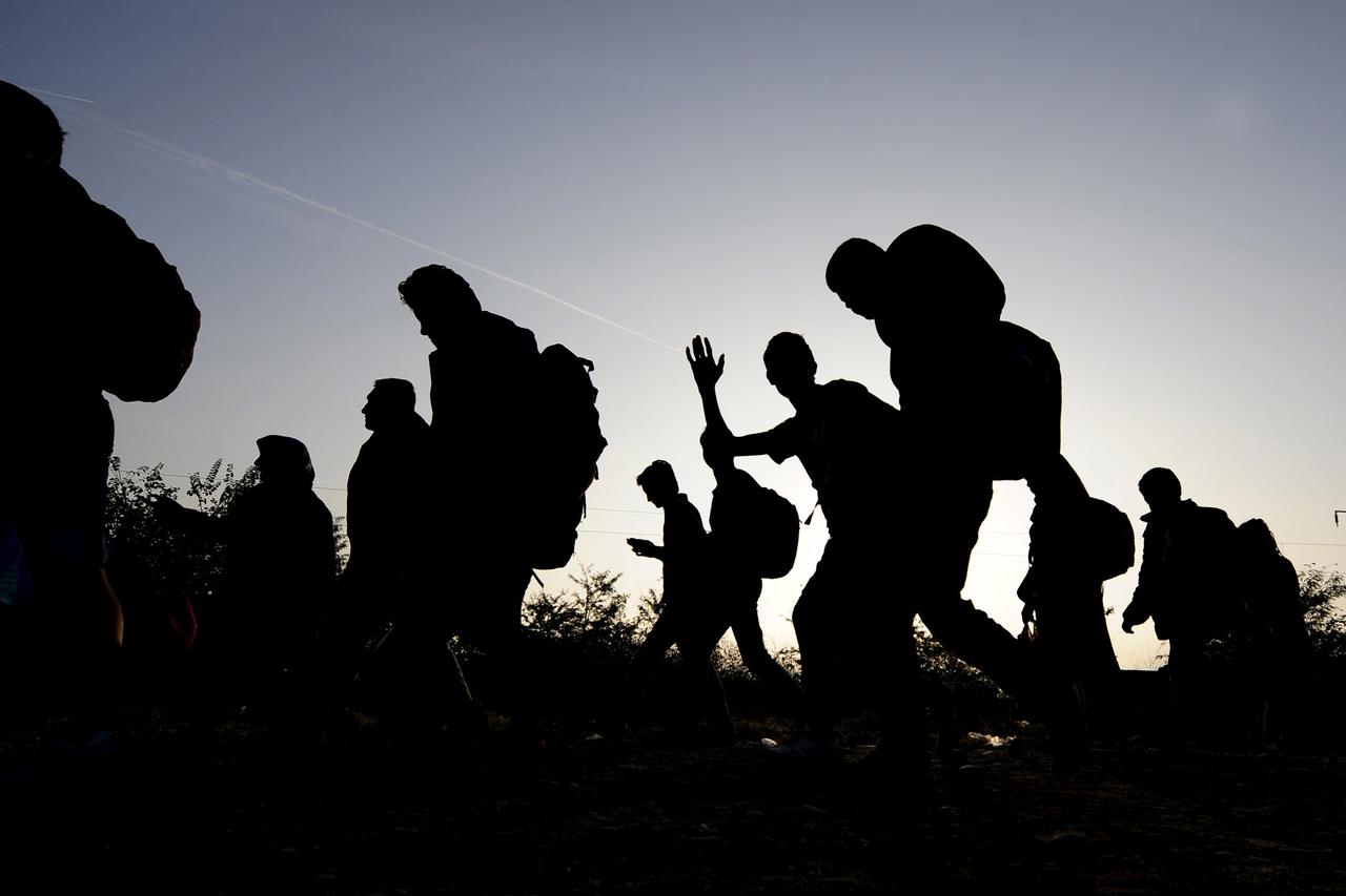 Migrants wait to enter a transit camp in Gevgelija, Macedonia, after entering the country by crossing the border with Greece, September 16, 2015.  Hungary's right-wing government shut the main land route for migrants into the European Union on Tuesday, ta