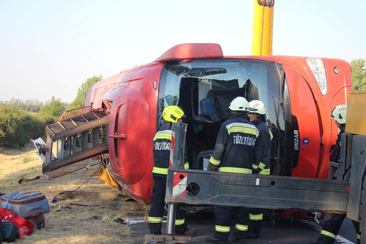 Firefighters work on the scene of a deadly accident near Mezokeresztes